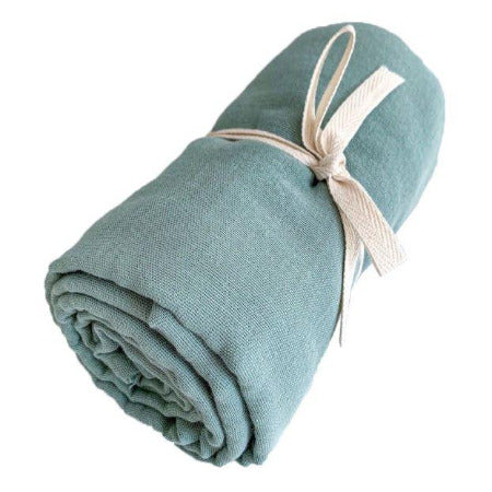 Sage wrap rolled up with tie holding it together